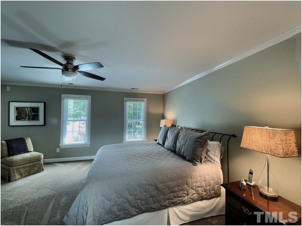 7908 Ogden Court Raleigh, NC 27613 - Photo 11 of 25 a bedroom with a bed and window