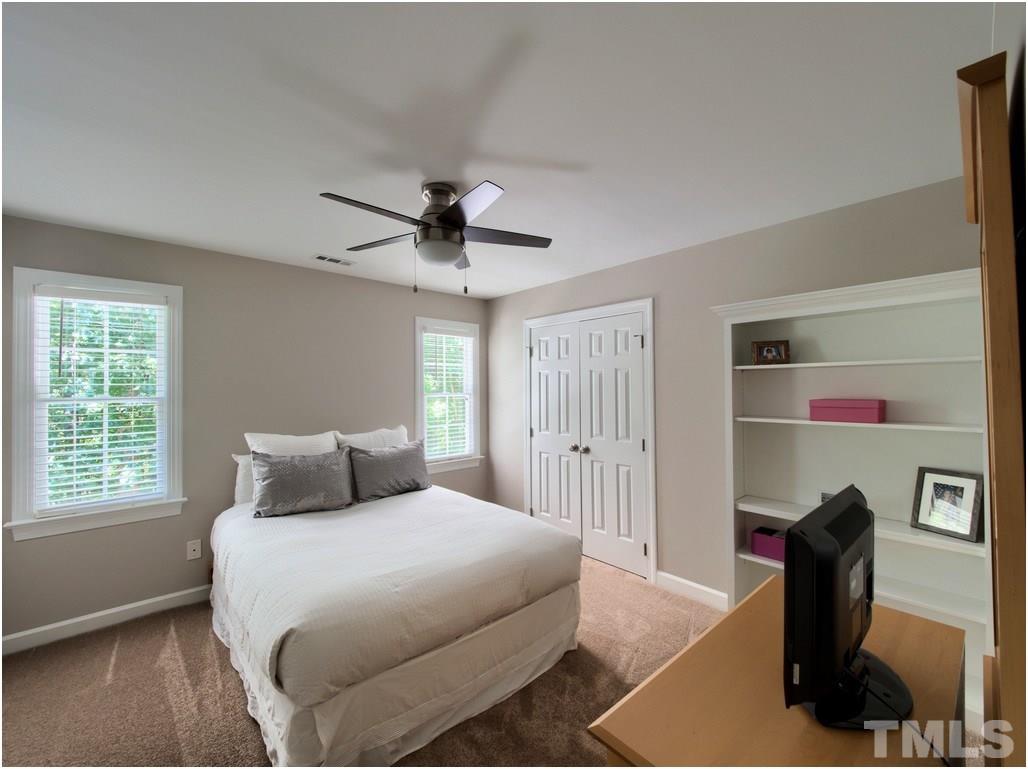 7908 Ogden Court Raleigh, NC 27613 - Photo 15 of 25 a bedroom with a bed and a window