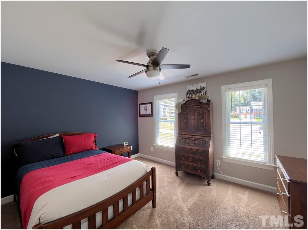 7908 Ogden Court Raleigh, NC 27613 - Photo 16 of 25 a bedroom with a bed and a window