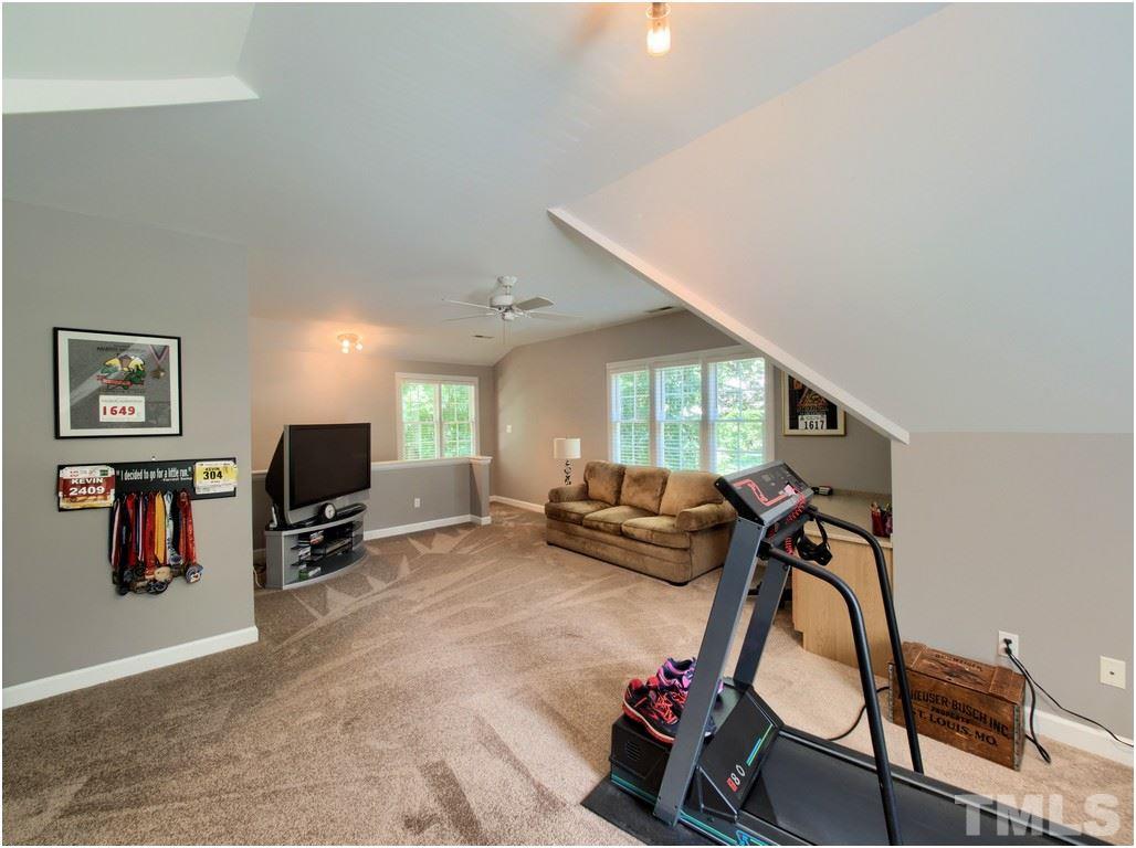 7908 Ogden Court Raleigh, NC 27613 - Photo 19 of 25 a view of a room with gym equipment