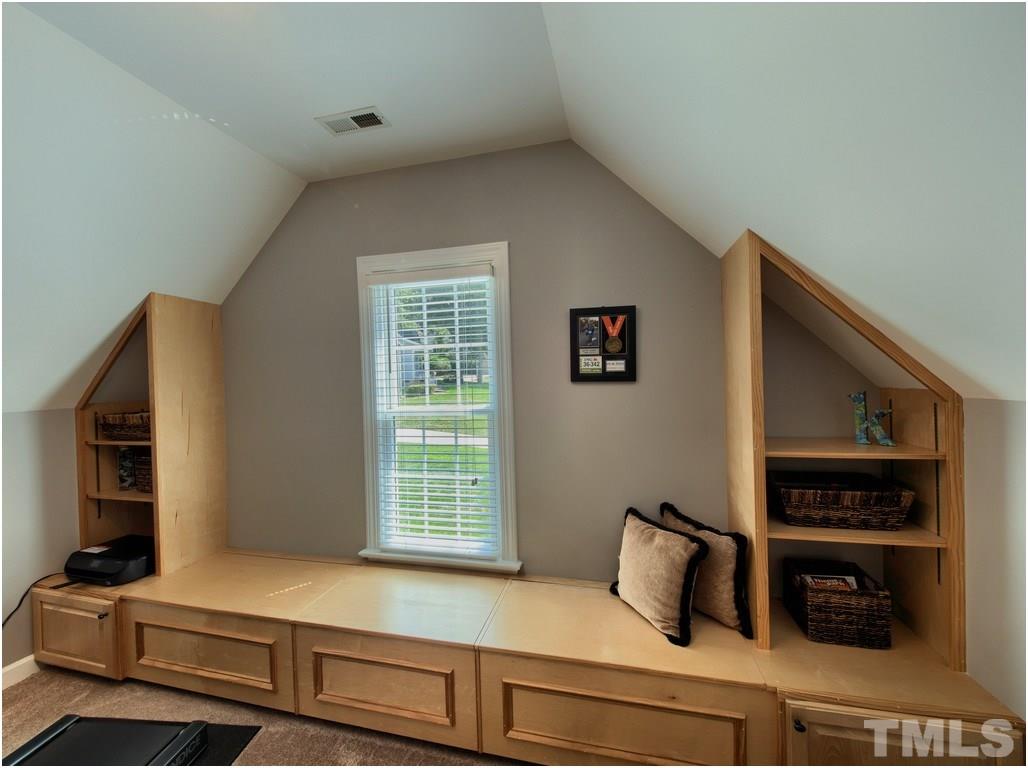 7908 Ogden Court Raleigh, NC 27613 - Photo 21 of 25 a bedroom with furniture and a window