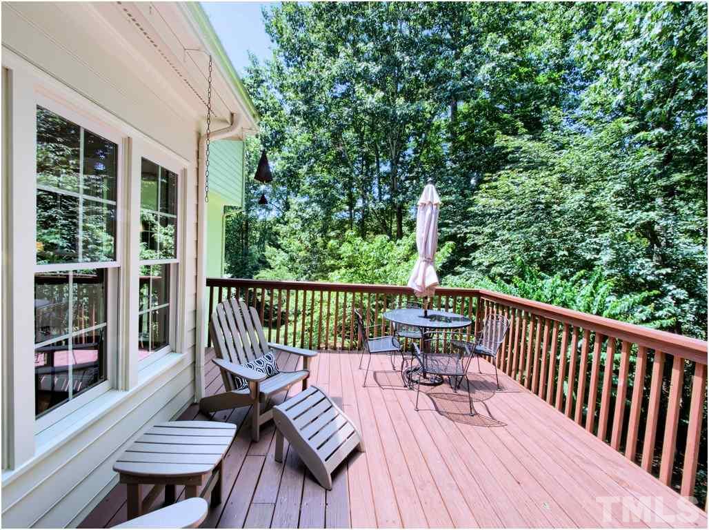 7908 Ogden Court Raleigh, NC 27613 - Photo 22 of 25 a view of a wooden chairs on deck with wooden floor