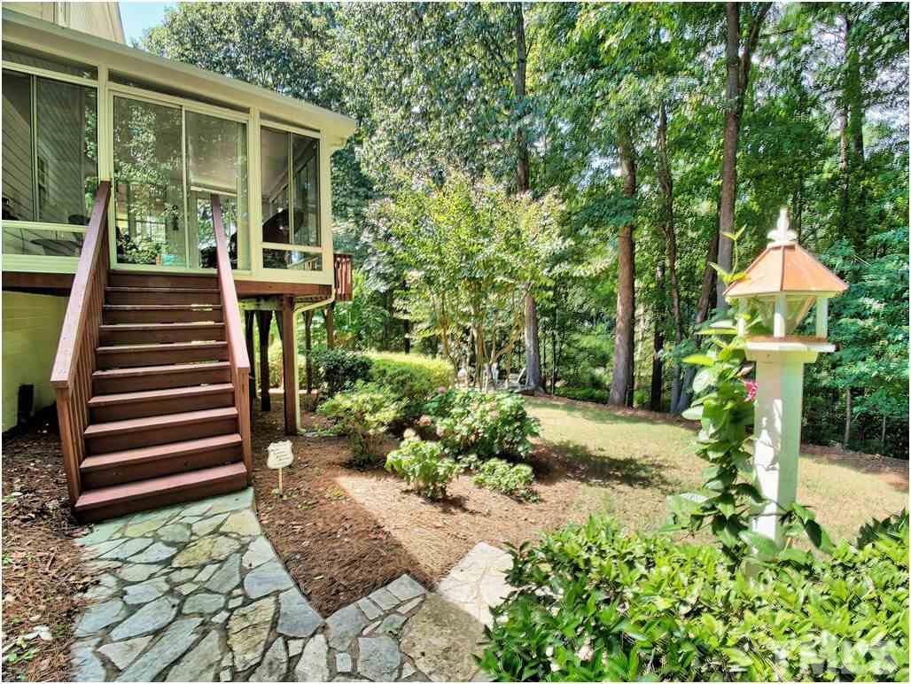 7908 Ogden Court Raleigh, NC 27613 - Photo 24 of 25 a front view of a house with garden