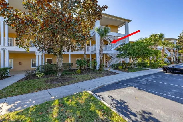 a front view of a house with a yard and a garage