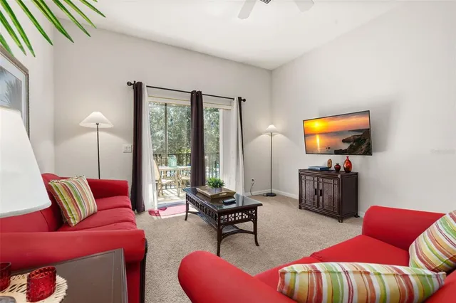 a spacious bedroom with a bed and a couch