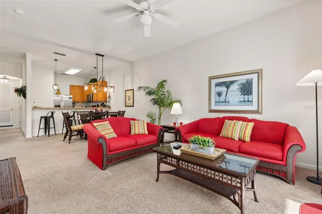 a spacious bedroom with a bed and a lamp