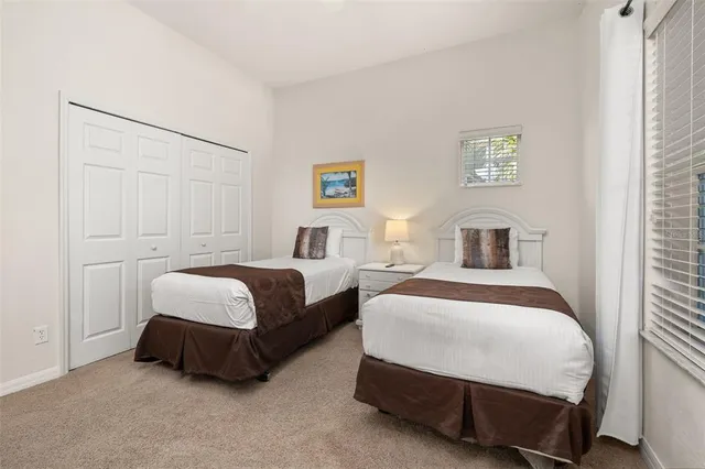 a front view of a house with a yard and a garage