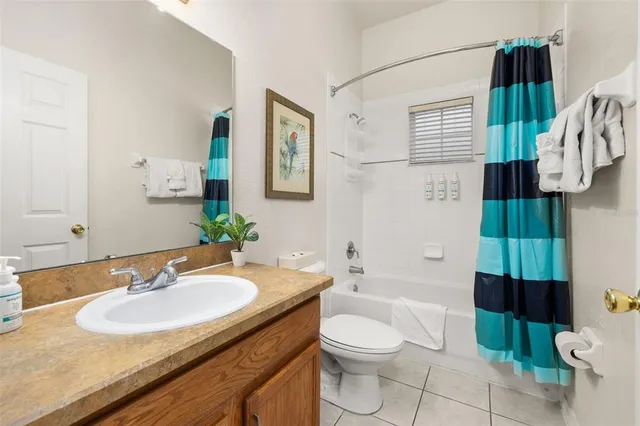 a living room with furniture and flowers
