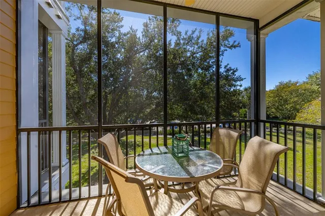 a view of a workspace with furniture window and wooden floor