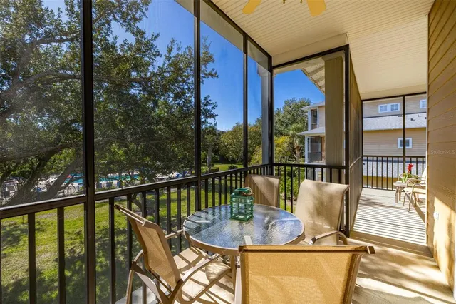 a large white kitchen with stainless steel appliances granite countertop a large window