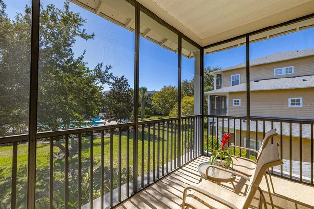 a swimming pool with yard and outdoor seating