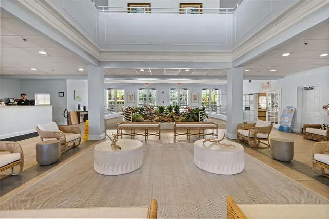 a view of swimming pool with outdoor seating and lake view