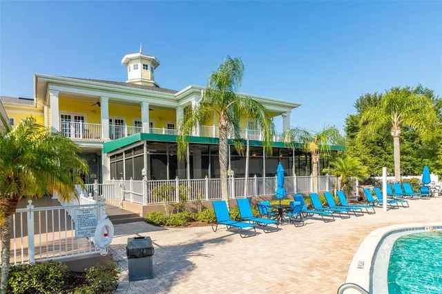 a view of a swimming pool with an outdoor space and seating area