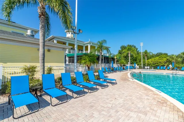 a view of a swimming pool with a table and chairs