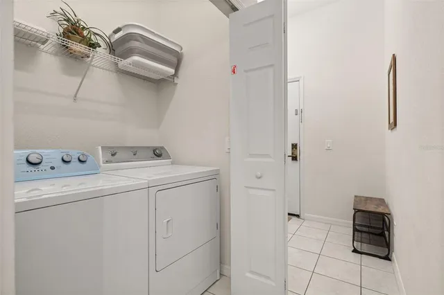 a view of kitchen with furniture and a potted plant