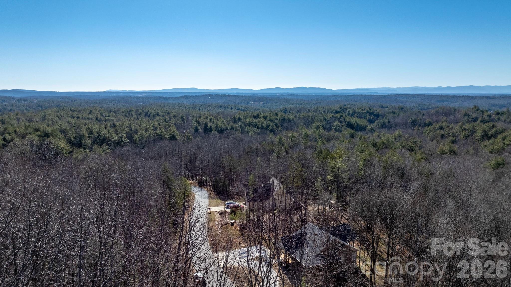 0 Round Rock Road Lenoir, NC 28645 - Photo 23 of 24 a view of a city with lush green forest
