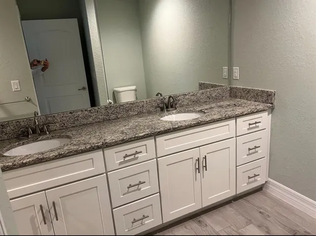 a bathroom with a sink and a mirror