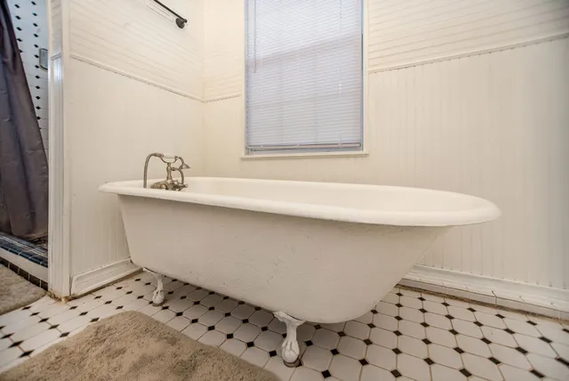 a bathroom with a sink a double vanity and a mirror