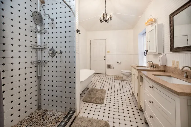 a living room with couches and a window