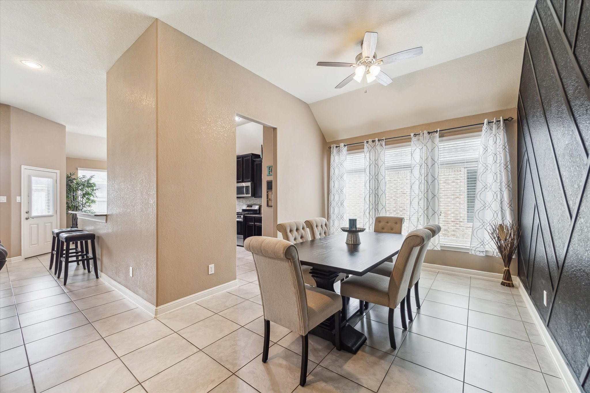 4914 Mountain Maple Trail Rosenberg, TX 77471 - Photo 6 of 24 Elegant dining room highlighted by a stunning custom accent wall that adds a touch of sophistication and style.