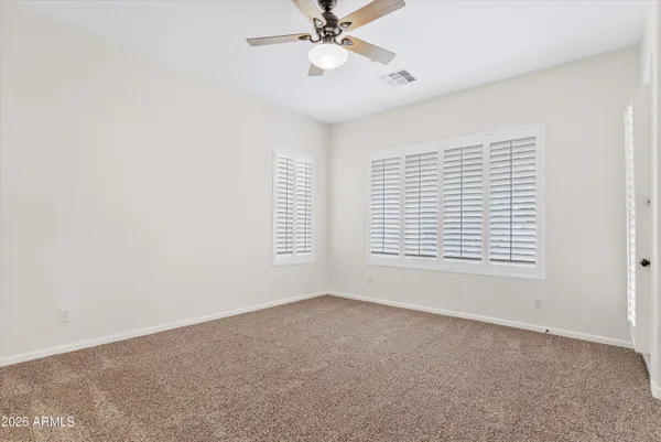 a spacious bathroom with a tub sink shower and mirror