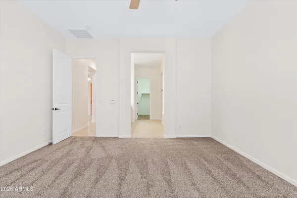 a spacious bathroom with a tub sink shower and mirror