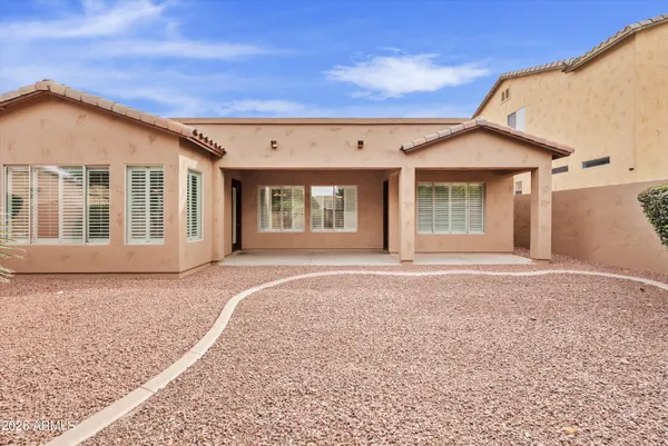 view of a vase of flowers sitting on a table
