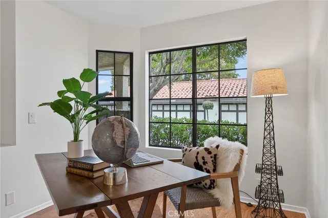 a dining room with furniture and window