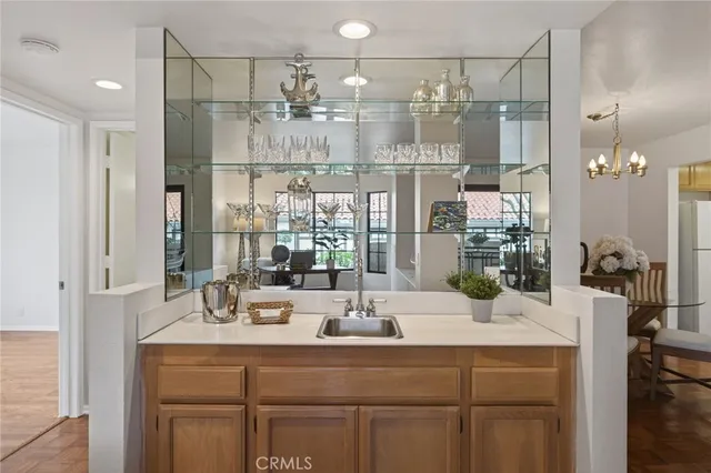 a view of a bathroom with a sink and mirror