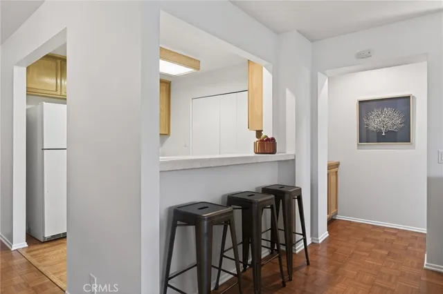 a view of dining room that has a table and chairs in it