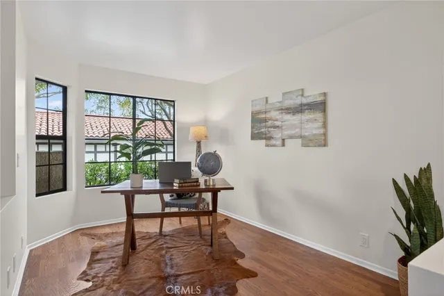 a workspace with furniture and a window