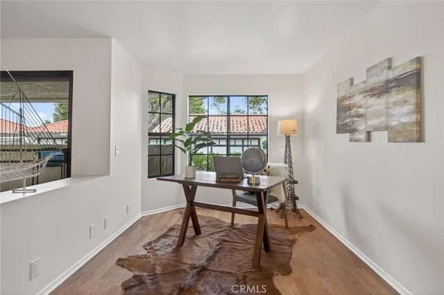 a work room with furniture and a window