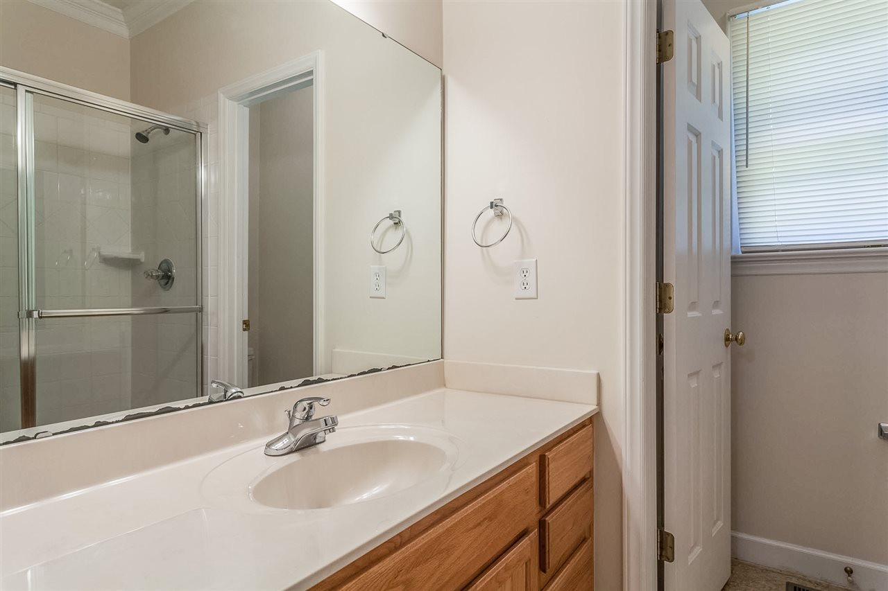 5445 Cottonrose Lane Raleigh, NC 27606 - Photo 11 of 22 First Floor Bedroom Full Bathroom
