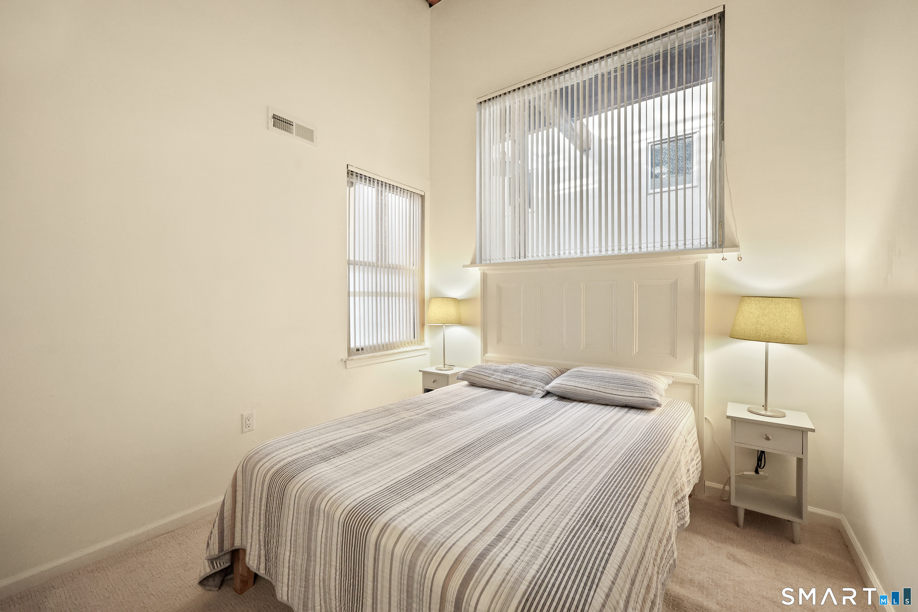 839 Main Street, Unit 40 Torrington, CT 06790 - Photo 12 of 31 a bedroom with a bed and a window