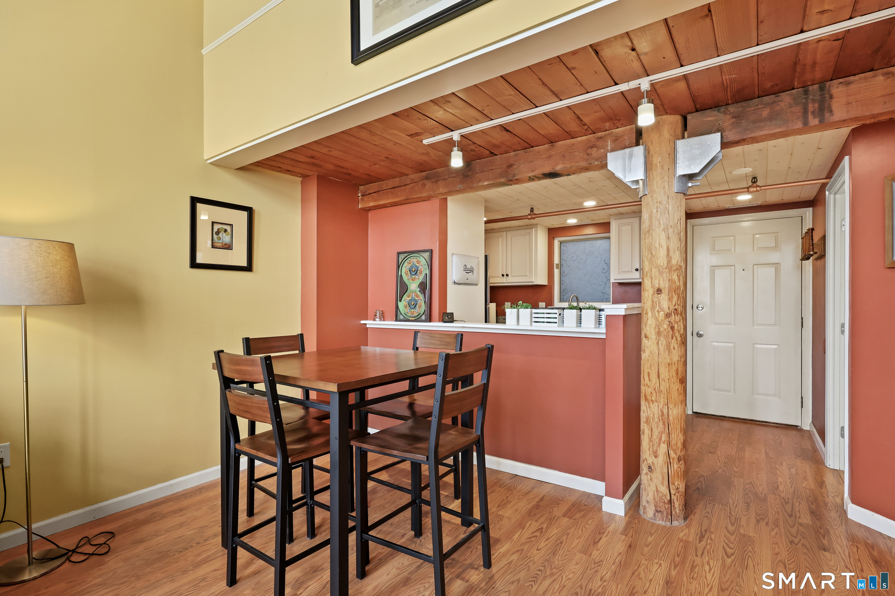 839 Main Street, Unit 40 Torrington, CT 06790 - Photo 16 of 31 a view of a dining room with furniture and wooden floor