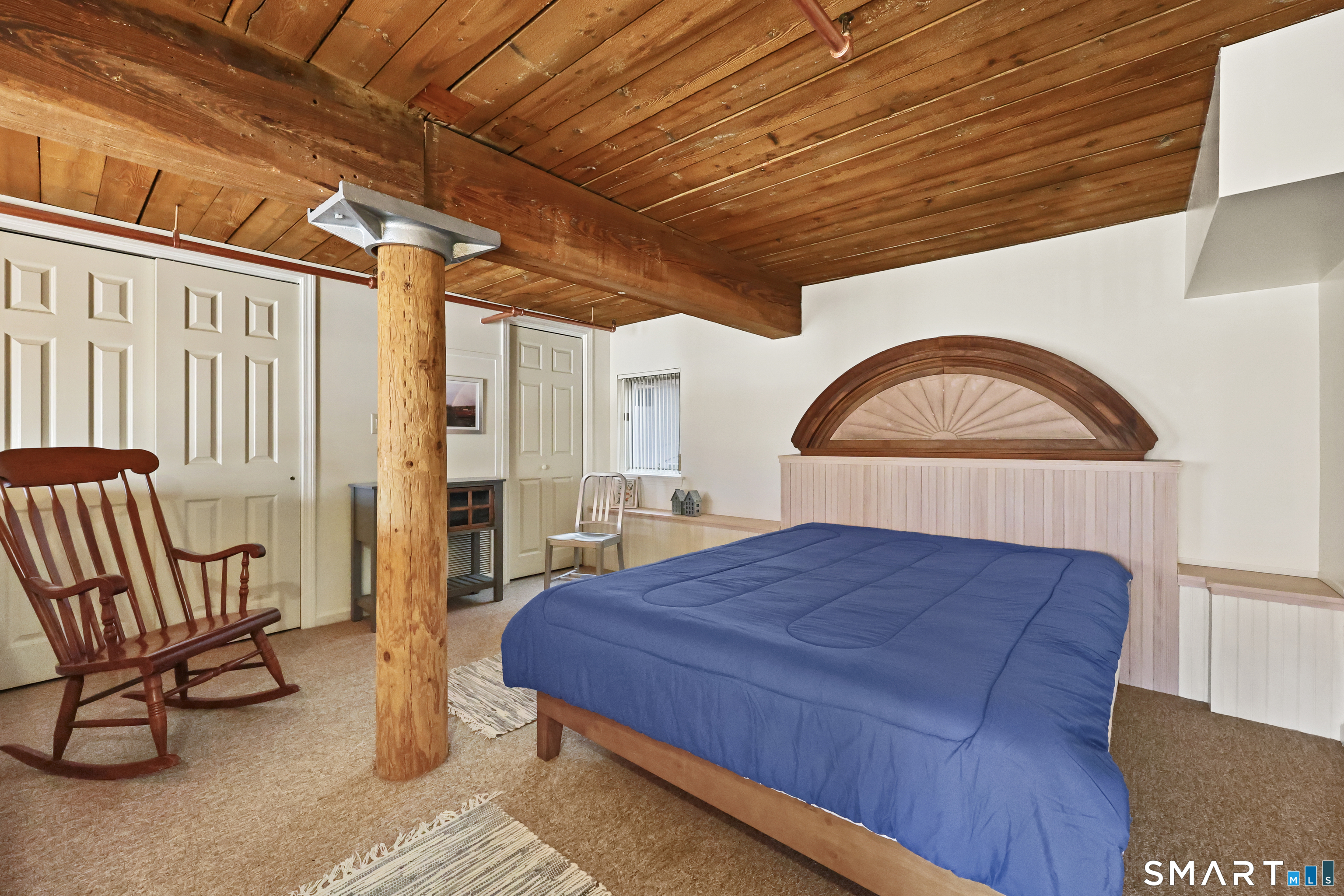 839 Main Street, Unit 40 Torrington, CT 06790 - Photo 22 of 31 a bed sitting in a spacious bedroom next to a window