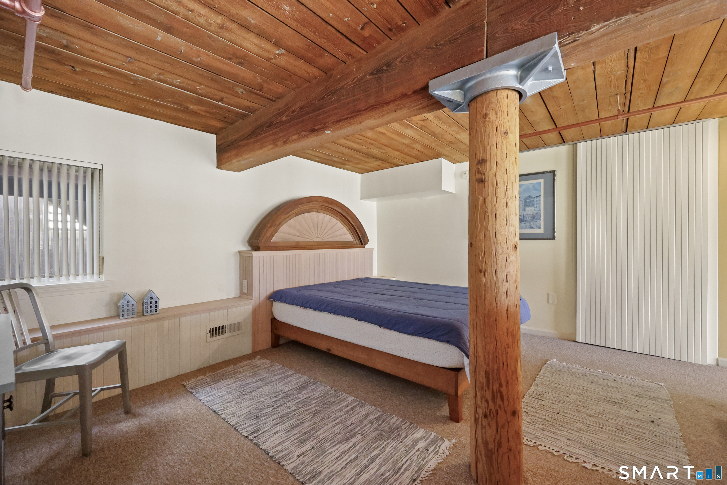 839 Main Street, Unit 40 Torrington, CT 06790 - Photo 23 of 31 a bedroom with bed and a window