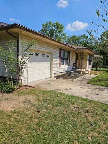 a backyard of a house with seating space