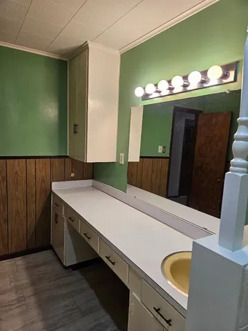 a kitchen with a sink and a refrigerator