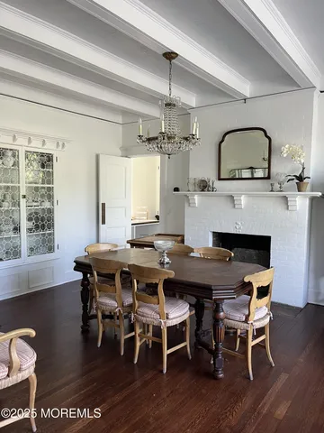 a bathroom with a granite countertop sink and a large window