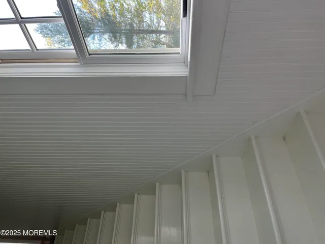 a view of a living room with a large window