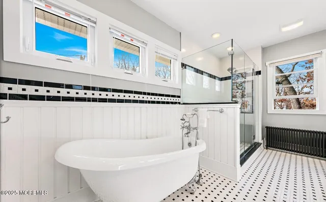 a bathroom with a shower and a sink