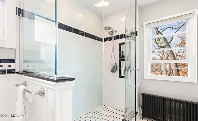 a bathroom with a toilet a sink and a mirror