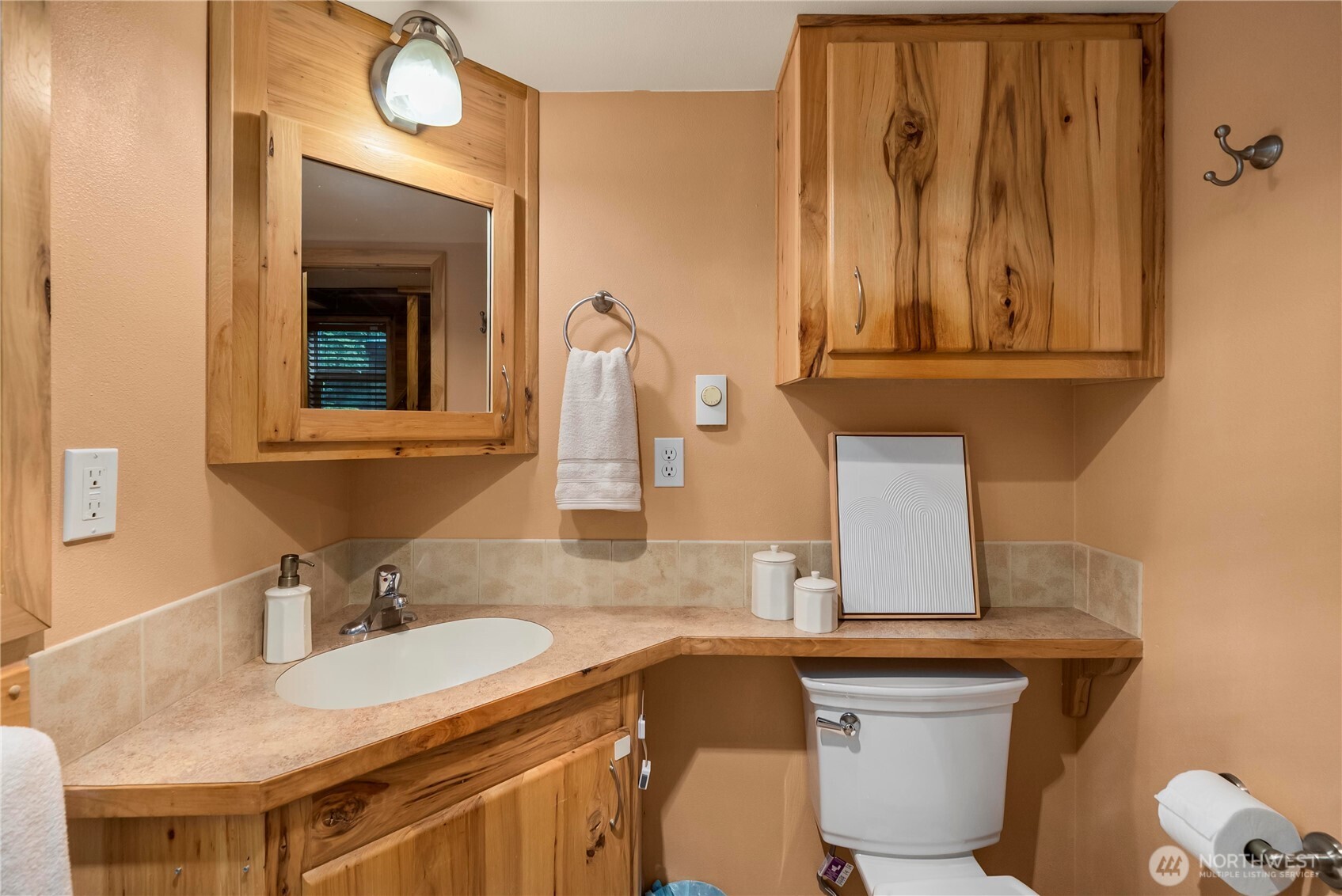 1546 Reservation Road Southeast, Unit 149 Olympia, WA 98513 - Photo 11 of 38 a bathroom with a granite countertop sink and a mirror