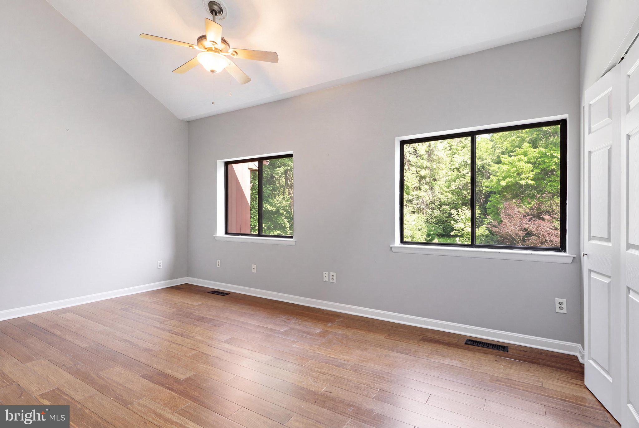 5538 Vantage Point Road Columbia, MD 21044 - Photo 20 of 50 a view of an empty room with a window and wooden floor