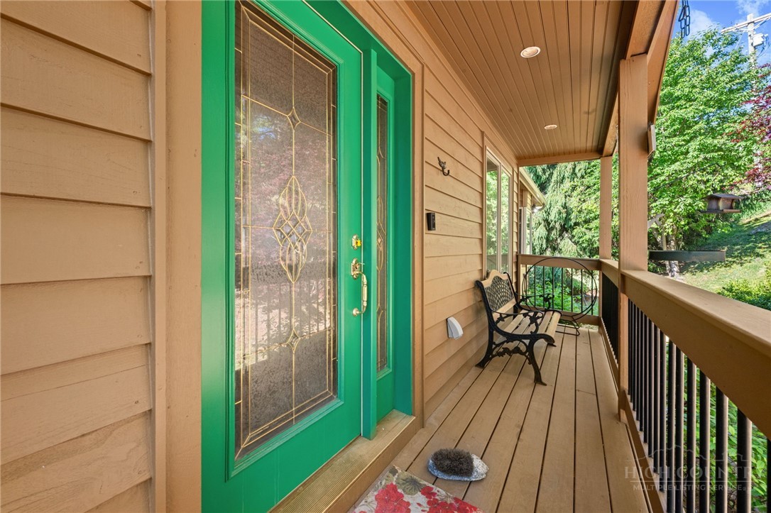 331 Alpine Road Blowing Rock, NC 28605 - Photo 10 of 50 a balcony with wooden floor table and chairs