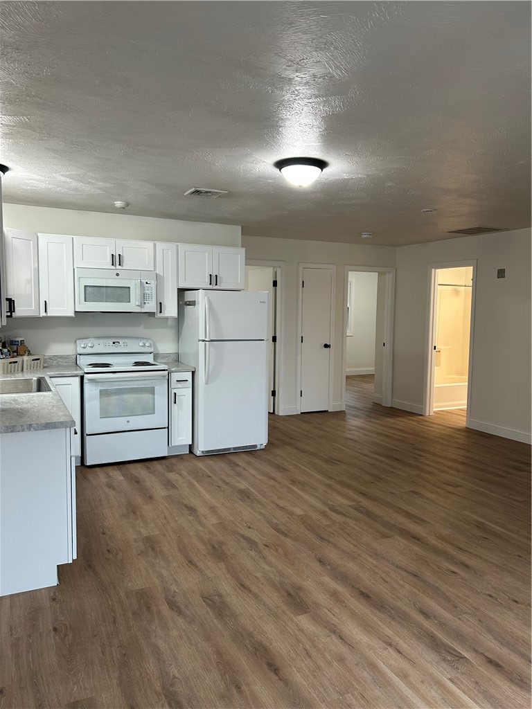 304 Front Street, Unit 2R Lincoln, RI 02865 - Photo 6 of 15 Kitchen opening to
bedrooms and bath