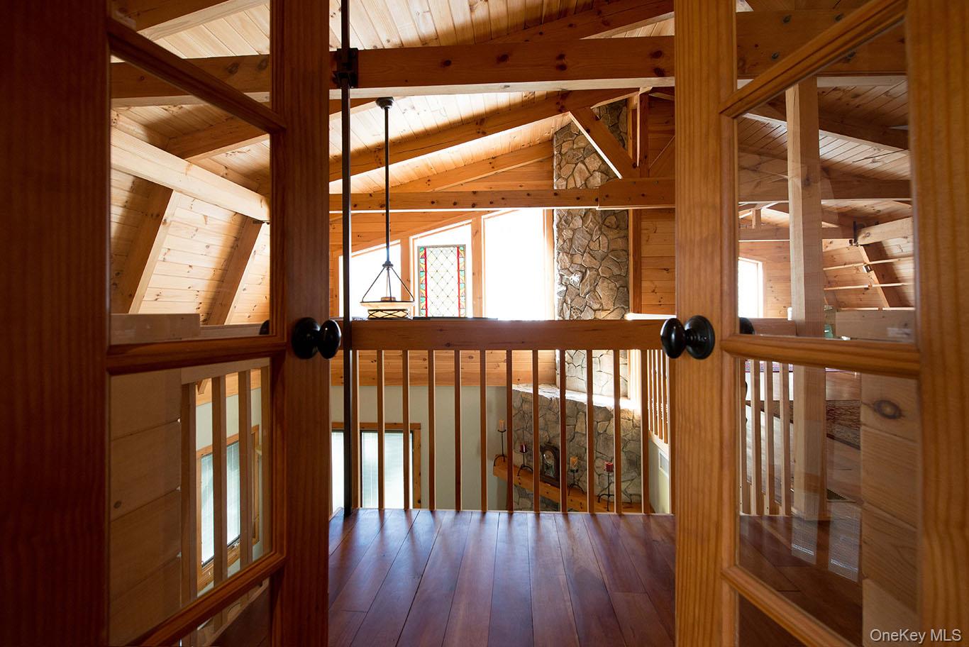 1644 Lakes Road Monroe, NY 10950 - Photo 16 of 49 a view of staircase with wooden floor and a window