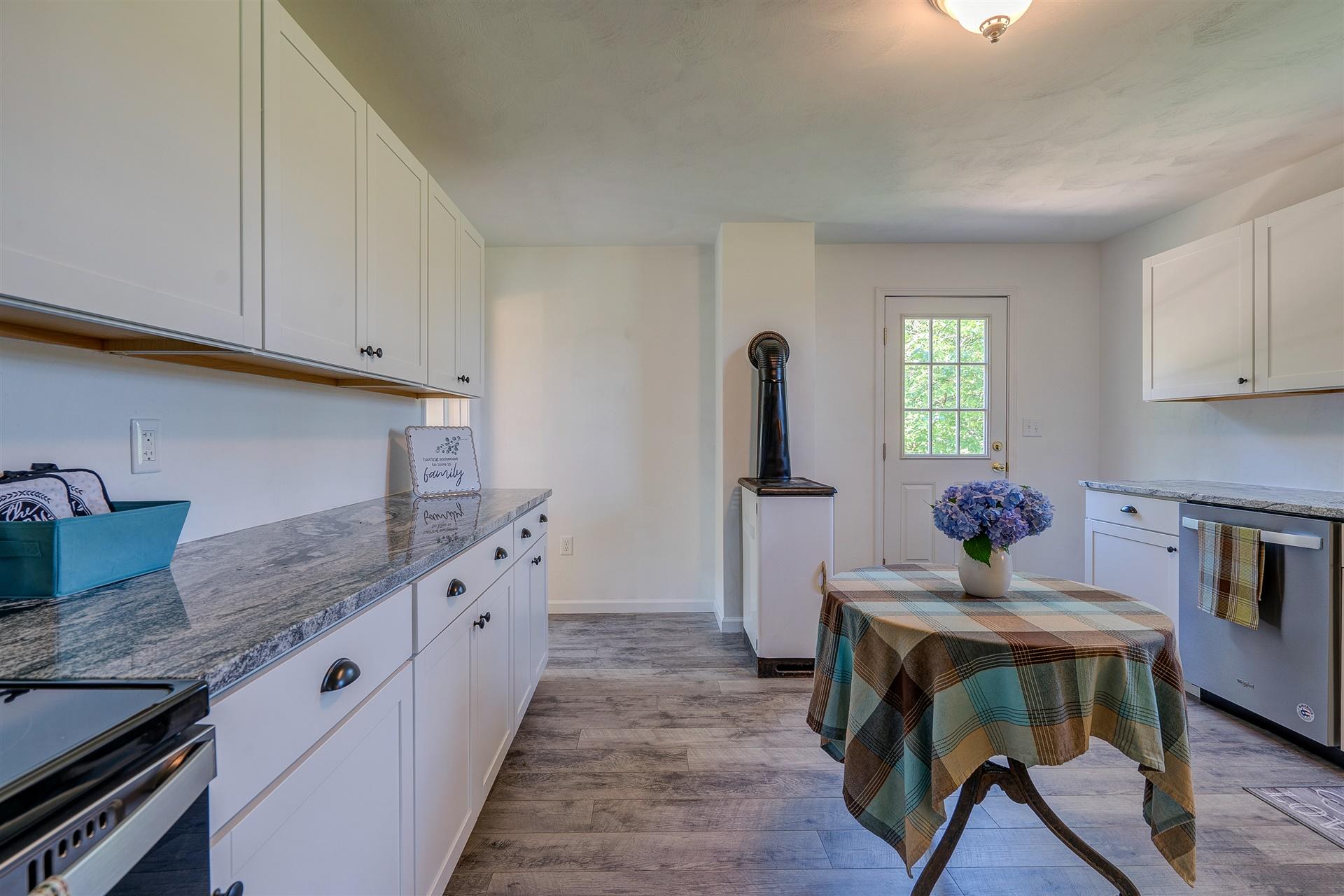 2137 Goodview Road Goodview, VA 24095 - Photo 15 of 37 a kitchen with sink cabinets and window