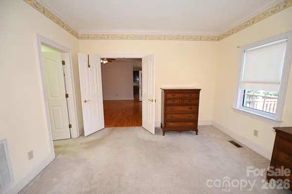 a view of room with furniture and a window